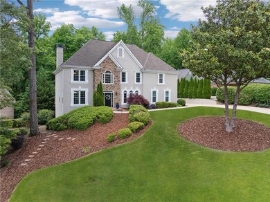 View of front of home with stone siding, stucco si