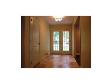 Expansive entry with travertine tiles