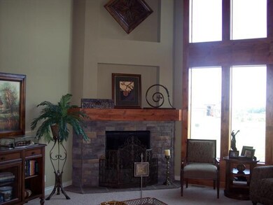 Corner fireplace with soaring ceilings and a view 