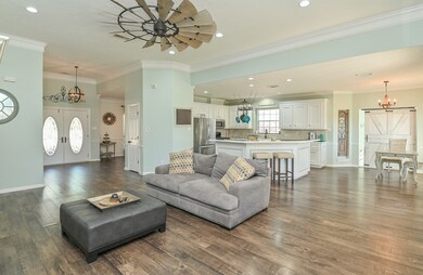 LARGE OPEN CONCEPT WITH RECENT WOOD LAMINATE FLOORING, PAINT AND SO MUCH MORE!