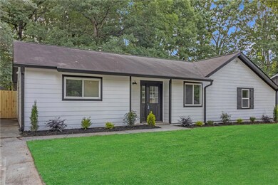 Single story home featuring a shingled roof