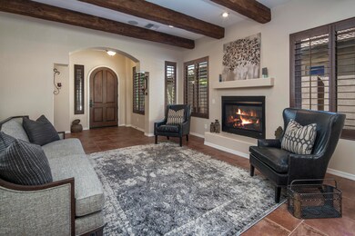 curved front door & beamed ceilings