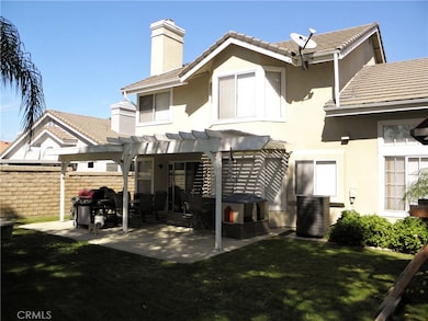 REAR VIEW - SHOWING PATIO AND CONDENSER UNIT. CENTRAL AIR SYSTEM LESS THAN 2 YEARS OLD.