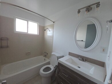Bathroom with shower / washtub combination and vanity