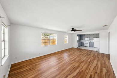 Unfurnished living room with light wood-type floo