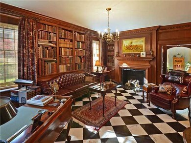 Walnut-paneled library