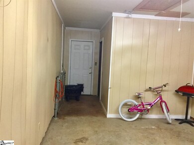 Garage with large storage room in rear