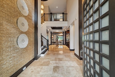 Welcome to a showstopping entrance where a soaring
