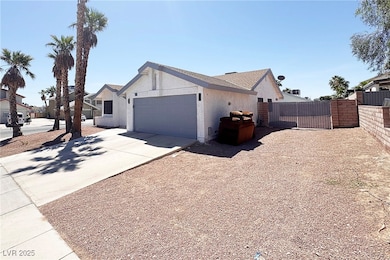 View of front of house featuring a garage, stucco