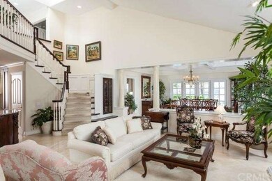 Entry way to formal living room and view of stairc