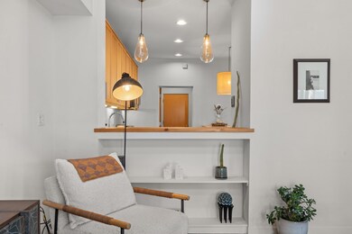 Peek a boo window from living room to kitchen