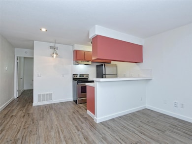 Kitchen featuring electric range, freestanding re