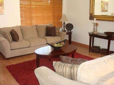 Step down Living Room with gleaming laminate floor