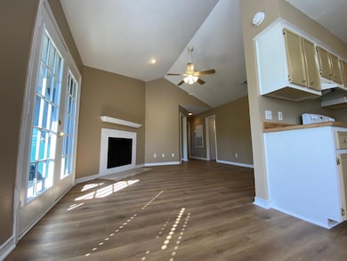 Unfurnished living room with dark wood finished f