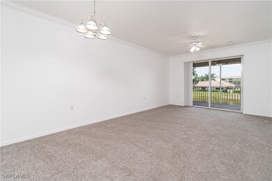 Empty room featuring baseboards, ornamental moldin