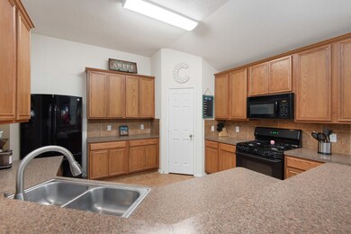 Open kitchen floorplan with breakfast bar, gas stove/oven, plenty of cabinets, large pantry, etc.