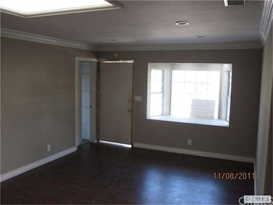 Living room with bay window looking over front yard