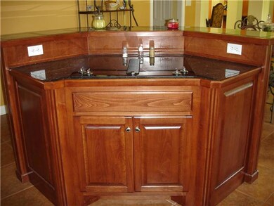 Jenn-Air cooktop island with raised bar