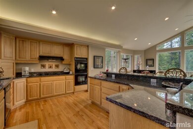 Kitchen with hardwood floors, oak cabinets, granit