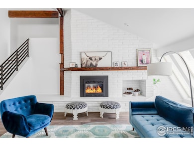 Wood flooring extends throughout, creating warmth and cohesion across the bright, open layout.