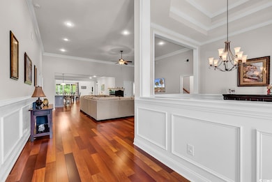 Interior space with dark wood finished floors, rec