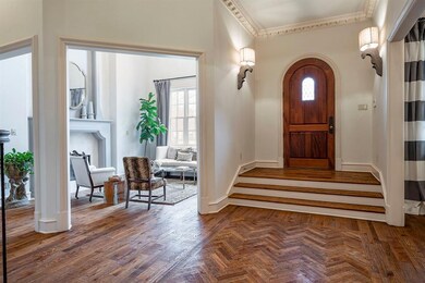 LEFT OF THE FOYER IS THE LARGE FORMAL DINING