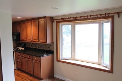 Bay window off kitchen into family room.