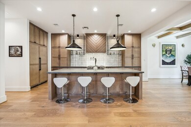 Kitchen is open to living and dining area and feat