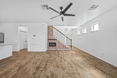 Unfurnished living room featuring visible vents, 