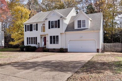 Beautiful curb appeal with an aggregate driveway and fenced in backyard