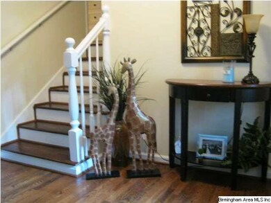 Hardwood foyer, steps, family room, kitchen and al