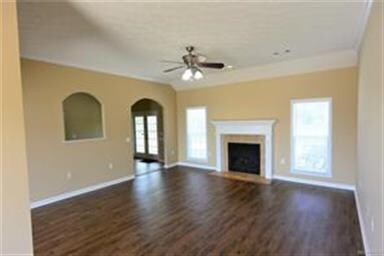 GREAT ROOM FEATURES A GAS LOG FIREPLACE, ARCHED OP