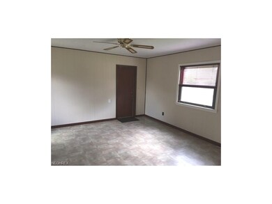 Family Room - Door leads to attached 2-car garage.