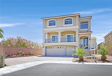 View of front of house with a garage, stucco sidin