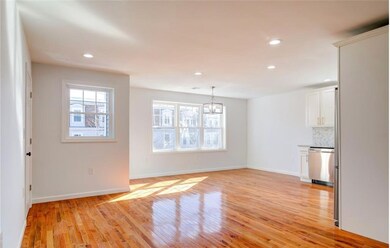 Living room/eat-in kitchen section of house
