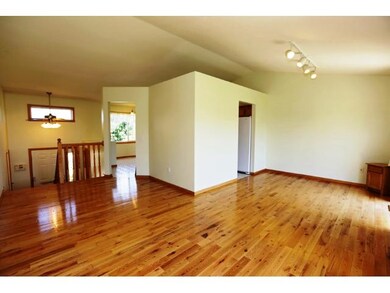 Gleaming hardwood floors in living and dining area