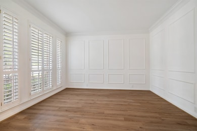 OFFICE WITH ELEGANT WOOD PANELS AT THE FRONT OF THE HOME