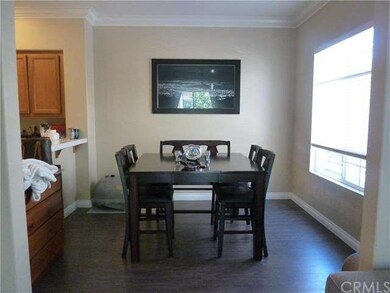 Large dining room with wood laminate floors and br
