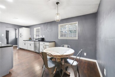 Dining space featuring dark wood finished floors a