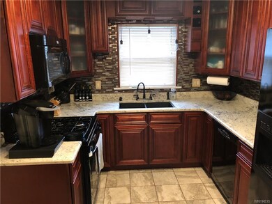 Kitchen with Granite counter tops and marble floor