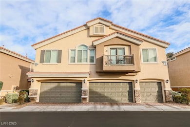 View of front of house featuring a balcony, a gara