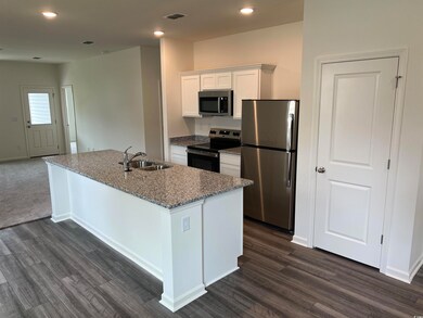 Kitchen featuring appliances with stainless steel 