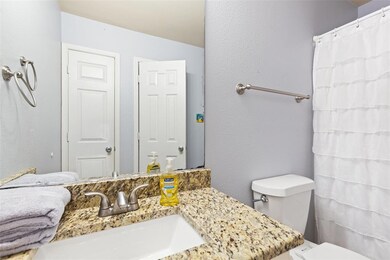 Full Bathroom with Granite Counter and Linen Close