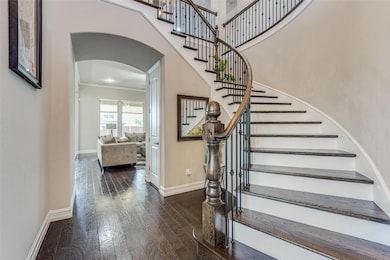 Elegant curved staircase with wood steps