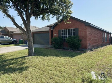 Single story home featuring a front lawn and a gar