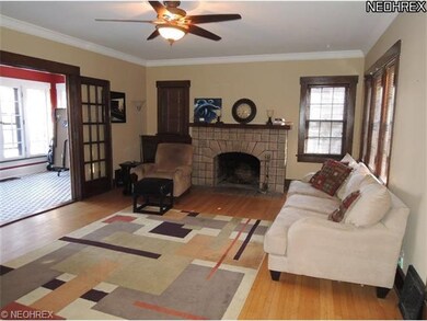 The beautiful living room features hardwood floors