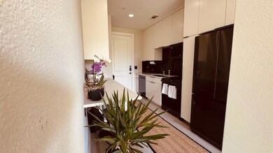 Kitchen featuring freestanding refrigerator, dish