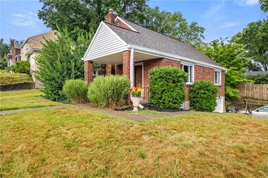 Cape Cod home sits atop a large corner lot
