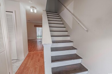 Stairs with hardwood / wood-style flooring