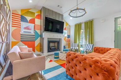 Interior space with a large fireplace, visible ven
